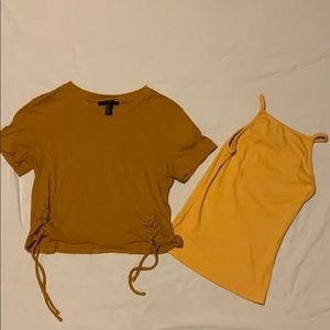 Two yellow crop tops